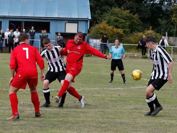 Action from Carluke Rovers' 3-2 win at Dunipace on Saturday which took them top of the league (Pic by Kevin Ramage)