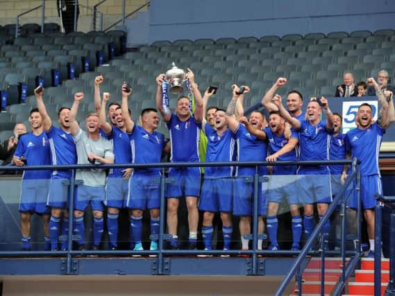 Colville Park AFC players celebrate winning this season's Scottish Amateur Cup
