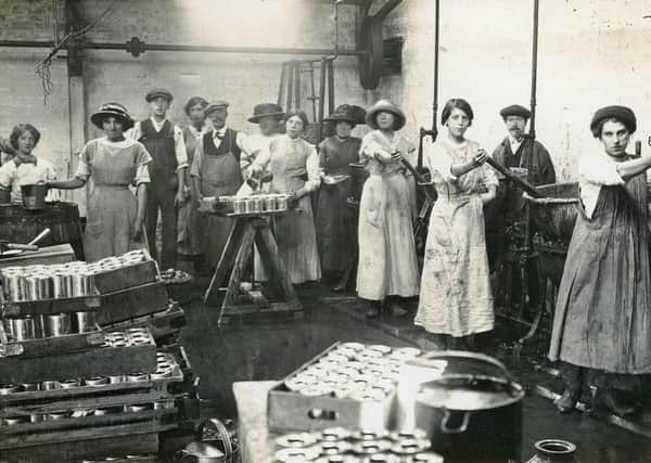 Fruits of their labour...making fruit preserves in the early 20th century, the canning process is seen in action here. (Pic: Lanark Museum)
