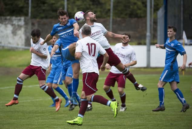 Action from the Duncansfield derby which Kilsyth won.