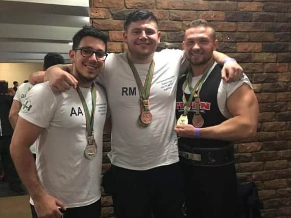 Hostile members (from left) Alexander, Robert and Jonathon with their Commonwealth medals (Submitted pic)
