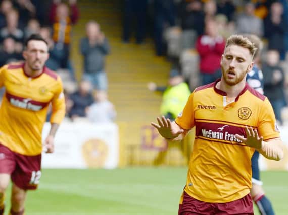 Louis Moult celebrates scoring against Ross County earlier this season (Pic by Alan Watson)