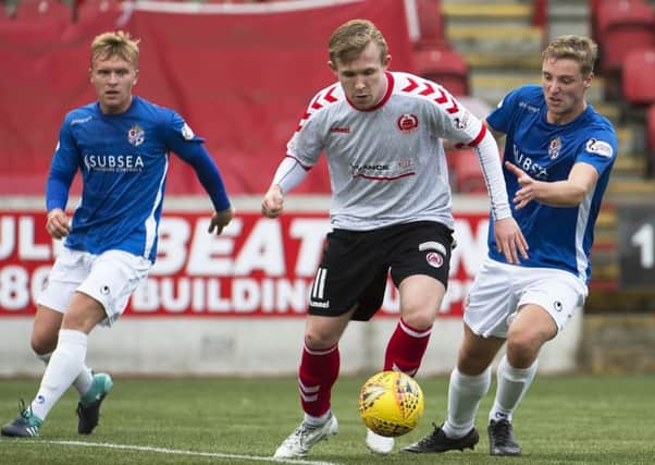 Darren Ramsay takes on two Cowdenbeath defenders