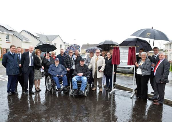 North Lanarkshire provost Jean Jones unveils the plaque at the new development in Oakdene Avenue, Tannochside