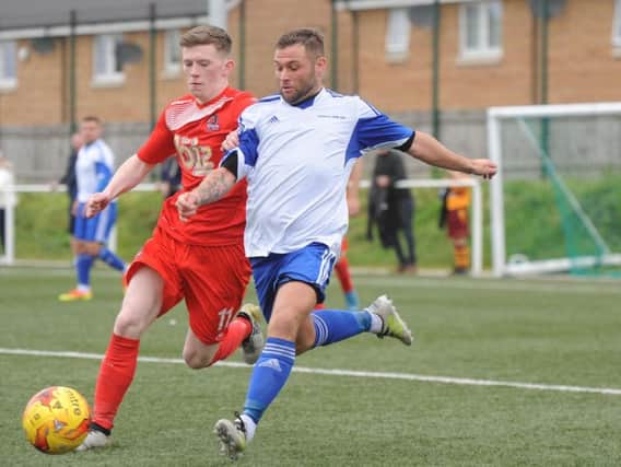 Colville Park AFC left-sided midfielder Tommy Murray (right) battles for possession against Cumbernauld Colts.