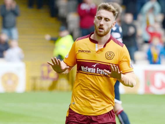 Louis Moult celebrates scoring against Ross County this season (Pic by Alan Watson)