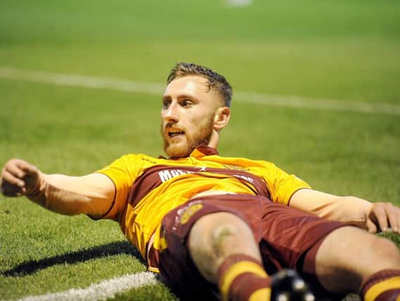 Louis Moult celebrates scoring one of his nine Motherwell goals this season (Pic by Michael Gillen)