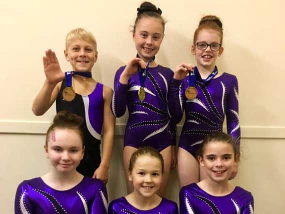 Lanark gymnasts who excelled in Perth are (from left), back row: Jamie, Kayleigh, Ella; front row: Riley, Rebecca, Madison.