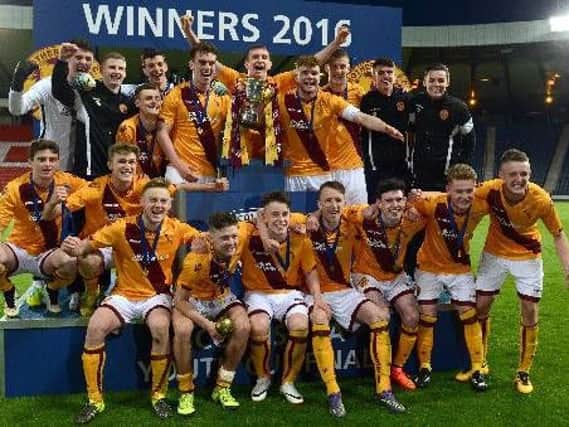 Adam Livingstone (back row, second from right) celebrates with his Motherwell under-20s team-mates after winning the 2016 Scottish Youth Cup