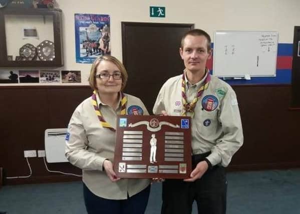 Maureen Boyle and Ian Forsyth with the Baird Watson Shield awarded to 1st Bellshill and Mossend Scouts