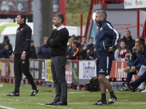 Motherwell gaffer Stephen Robinson (centre) surveys the Superseal Stadium action with 'Well assistant Keith Lasley and Hamilton manager Martin Canning (Pic by Karen Gordon)