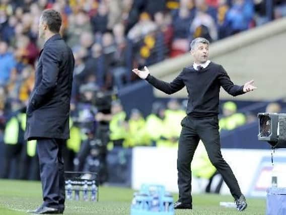 Stephen Robinson (right) has led his Motherwell team to third place in the Scottish Premiership, a point clear of the Rangers side bossed by Pedro Caixinha (left)