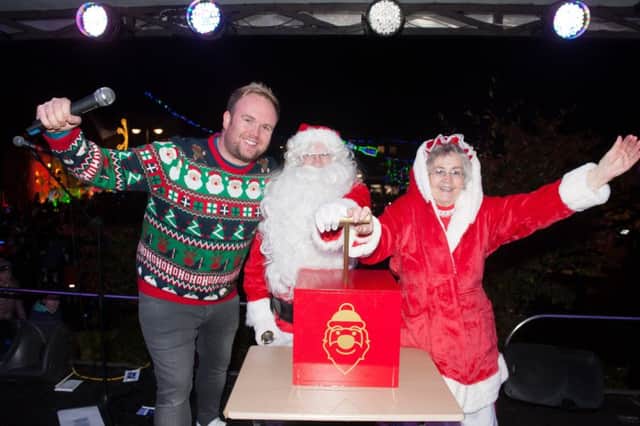 DJ Paul Harper joined Mr and Mrs Claus at the event which (top) lit up the town. Pic: Jamie Forbes