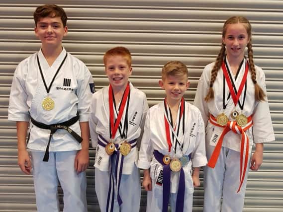 Blackwood karate aces (from left) Daryl Simpson, Corey Stevenson, Charlie Miller and Caitlyn Tops all won medals (Submitted pic)