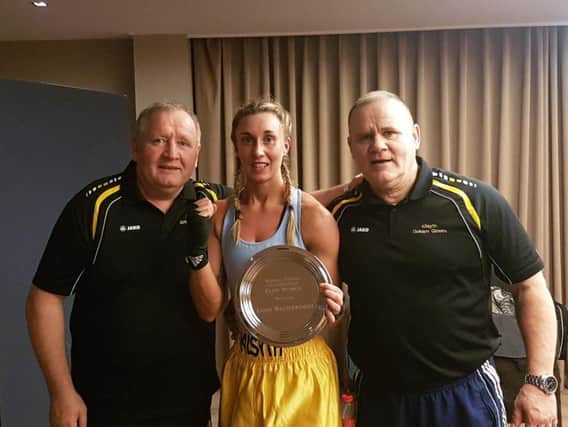 Western champ Stacey McGhee with Golden Gloves coachesJohnny Heaney (left) and Francie Connor