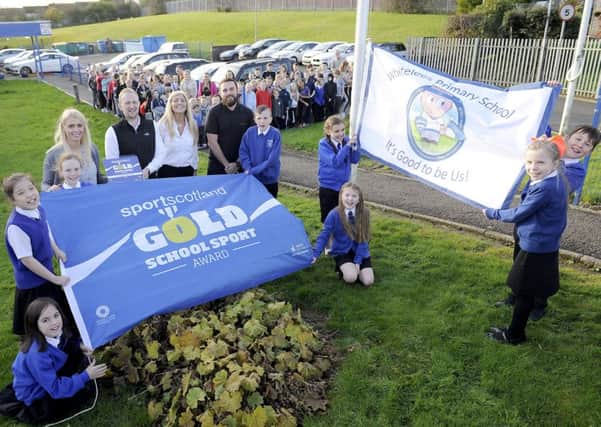 Whitelees Primary celebrates be awarded a Gold School Sport Award from Sportscotland. Pic: Michael Gilen