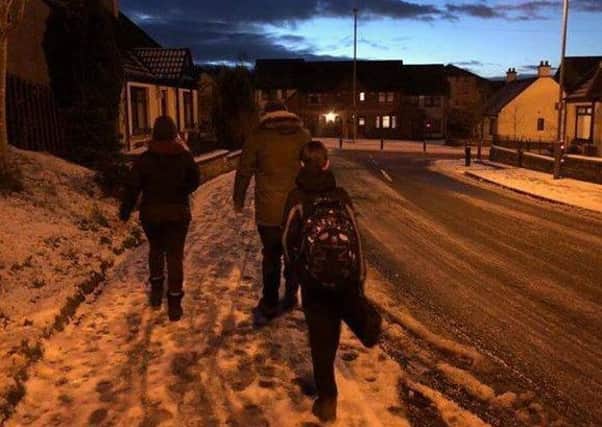 Braving the snow and the ice on Friday to demonstrate the safety issues that can be found of the safe walking route from Craigmarloch  to Greenfaulds High