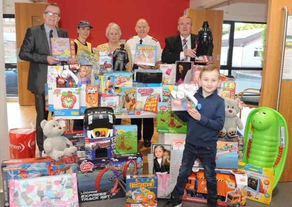 Charity champion Ray Mitchell Â£1000 worth of toys to the appeal at Bellshill Salvation Army Hall raised from running a raffle at Bellshill Post Office every week. She would like to thank all the customers of the post office as well as Lawmuir Stores and Sandy Cooper Butchers for their kind donations. Pic: Jamie Forbes