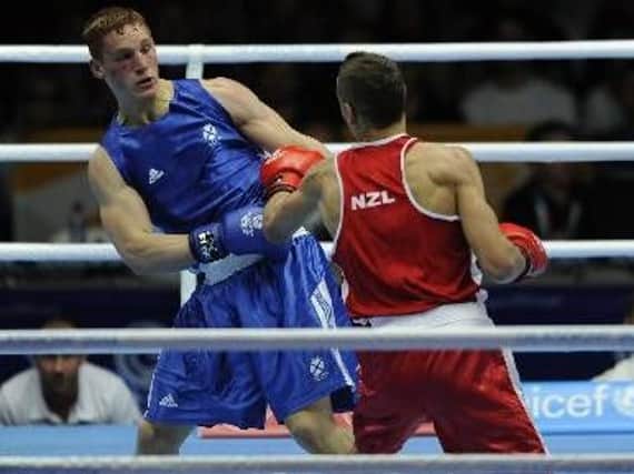 Scott Forrest on his way to defeat against David Nyika at 2014 Commonwealth Games in Glasgow (Pic by Andrew O'Brien)