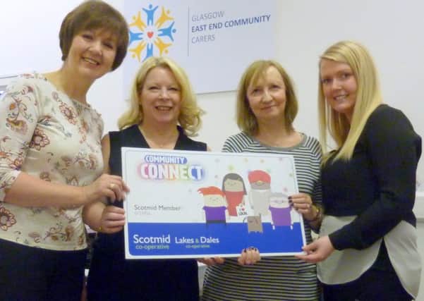 Elizabeth McIntosh with Doreen Hogg, project manager (Older Carer Services), Adrienne Cunningham, information and support manager and Gillian Andrews, admin officer.