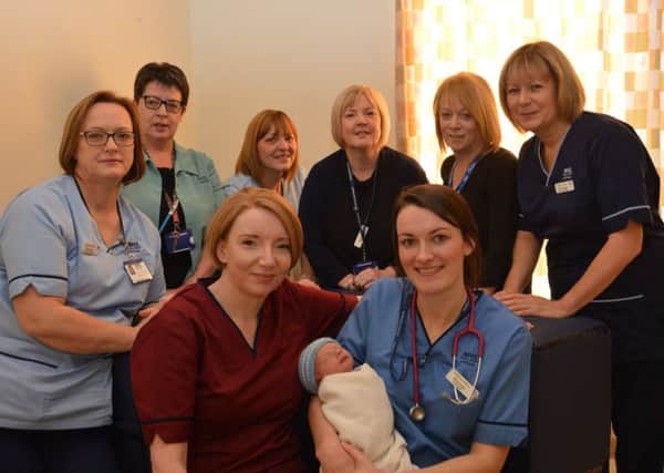 Maureen McSherry (back, second from right) and Lyn Clyde (back, third from right) with members of the maternity team and baby Hunter Ness. Hunters mum is also an NHS Lanarkshire midwife.