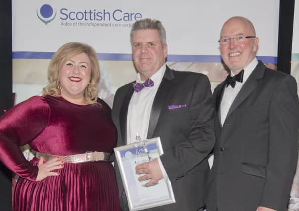 John is presented with the award by Michelle McManus and Meallmore managing director Gerard Hennessey