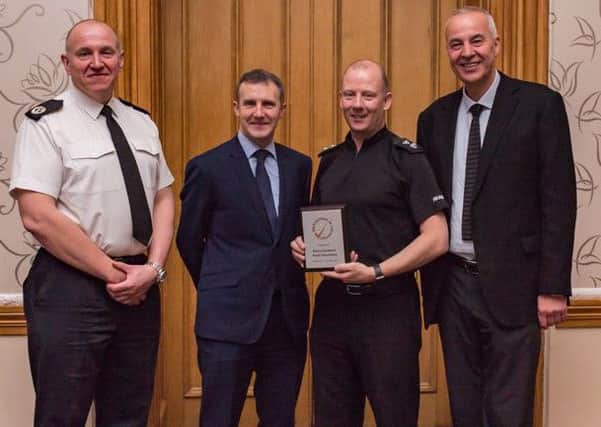 L-R Assistant Chief Constable John Hawkins; Cabinet Secretary for Justice, Michael Matheson; Craig Rankine, national Co-ordinator, and George Thomson, Investing in Volunteers manager for Scotland.