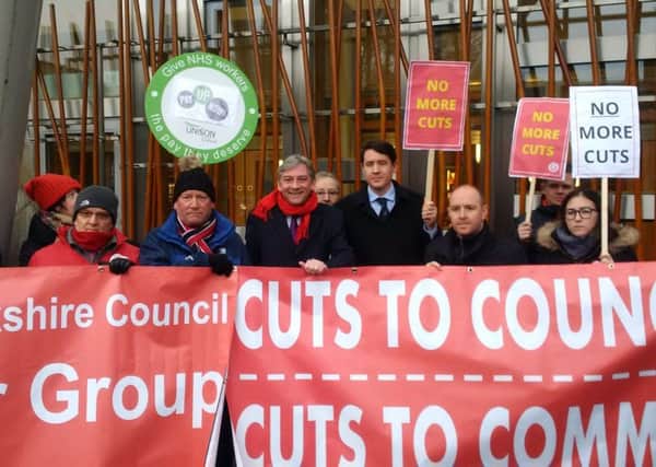 North Lanarkshire councillors join Scottish Labour leader and Central Scotland list MSP Richard Leonard as they protest at the Scottish Parliament ahead of the draft budget settlement being announced