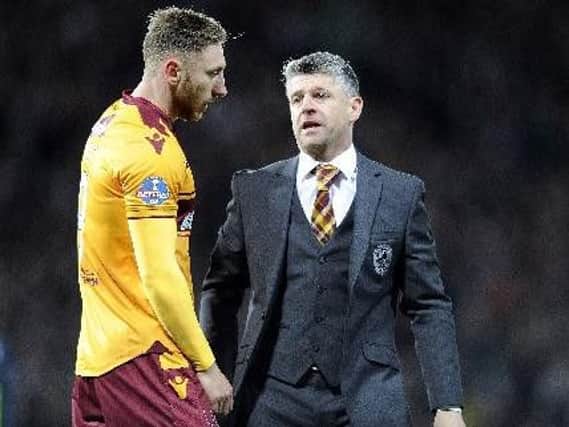 Motherwell manager Stephen Robinson consoles Louis Moult after the 2-0 Betfred Cup final defeat to Celtic at Hampden Park on November 26 (Pic by Michael Gillen)