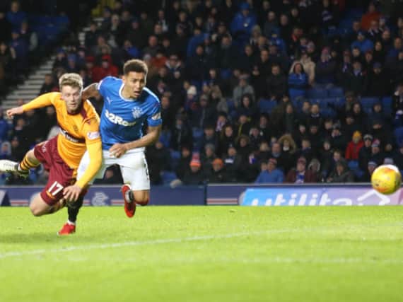 Motherwell striker Alex Fisher heads just wide of the post during the Steelmen's 2-0 defeat at Ibrox (Pic by Ian McFadyen)