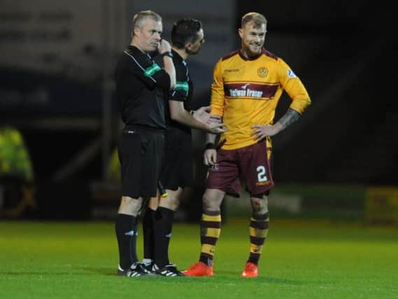 Motherwell's Richard Tait smiles during a post match chat with referee Andrew Dallas (Pic by Angie Isac)