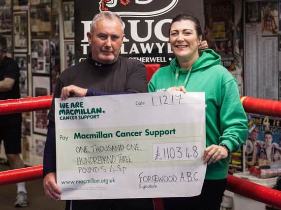 Bert McShane, head coach of Motherwells Forgewood ABC, presents cheque to Angela McCormack of Macmillan Cancer Support (Pic by Les Kingstone)