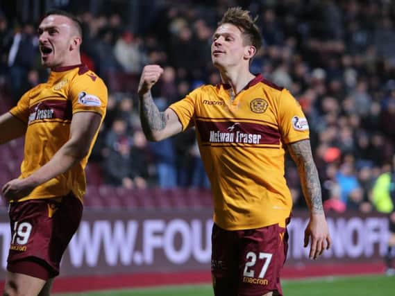 Tom Aldred (left) and Craig Tanner celebrate Motherwell's last gasp equaliser at Tynecastle (Pic by Ian McFadyen)