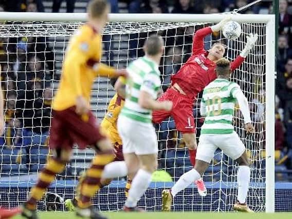 Motherwell goalkeeper Trevor Carson makes a save against Celtic in this season's Betfred Cup final (Pic by Michael Gillen)