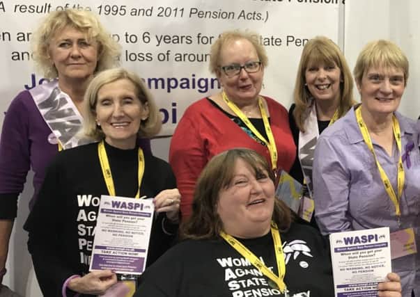 Motherwell and Wishaw MP Marion Fellows (back row,centre) with Women Against State Pension Inequality (WASPI) campaigners
