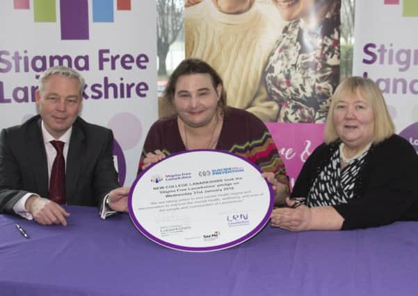 Principal Martin McGuire; Avril Cutler of Stigma Free Scotland and Linda McTavish, chair of the Lanarkshire Regional Board sign the pledge.