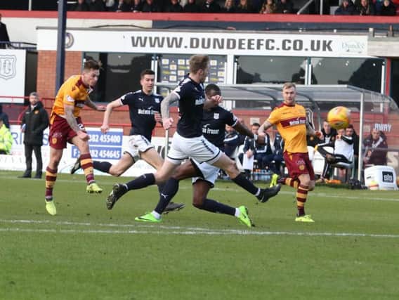 Motherwell ace Craig Tanner fires home the opening goal in Saturday's William Hill Scottish Cup fifth round tie at Dens Park (Pic by Ian McFadyen)