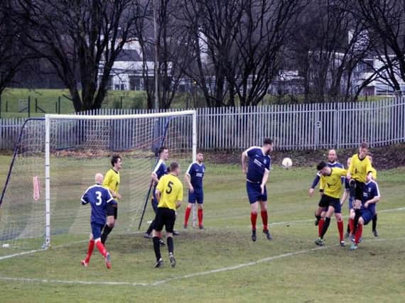Jonathan Reynolds heads home the opening goal of his hat-trick in Bellshills 3-0 league win at Vale of Leven (Pic by Brian Closs)