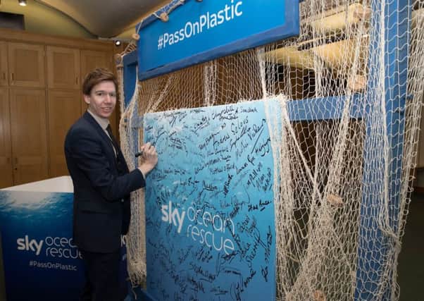 East Renfrewshire MP Paul Masterton signs the #PassOnPlastic pledge. Picture by Stephen Lock.