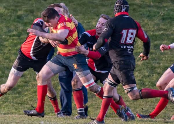 Lasswade v West of Scotland - Tacklers converge on Mark Davis (pic by John Cameron).