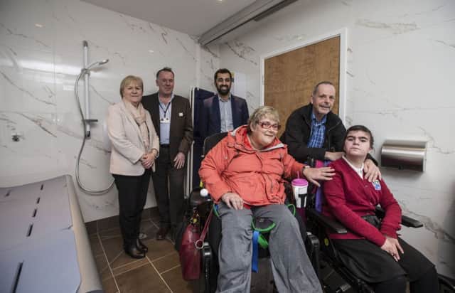 Back row - Johann Lamont MSP, David Pierotti, centre manager, Humza Yousaf.

Front row - Kirsty McNab, Brett Millett, and his daughter Ruth Millett (15) at the new Changing Places facilities at Silverburn.