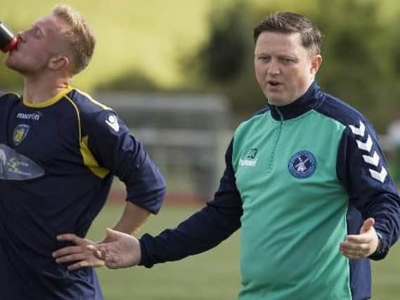 Paul Davies (right) has been named as co-manager of Newmains United Juniors