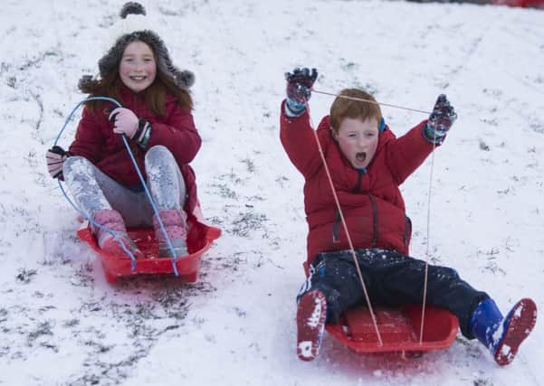 Some people are able to enjoy the snow which is causing disruption across North Lanarkshire. Pic: SWNS