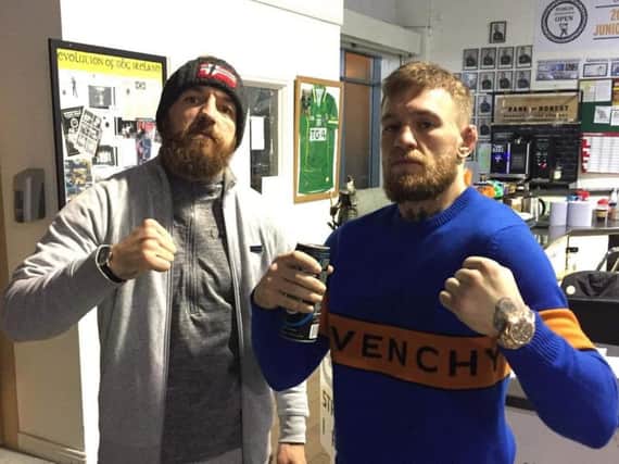 Chris Bungard (left) pictured with Conor McGregor at Dublin training camp
