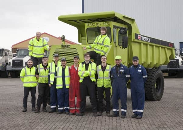 Some of the apprentices involved in the project with the refurbished Terex Trucks R17
