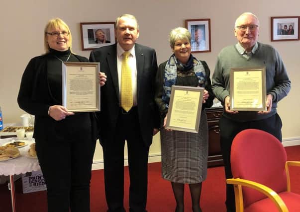 Uddingston and Bellshill MSP Richard Lyle visits Newarthill Credit Union to present the framed motions to manager Jackie Sweeney and volunteers Rose Reilly and Bobby Lees