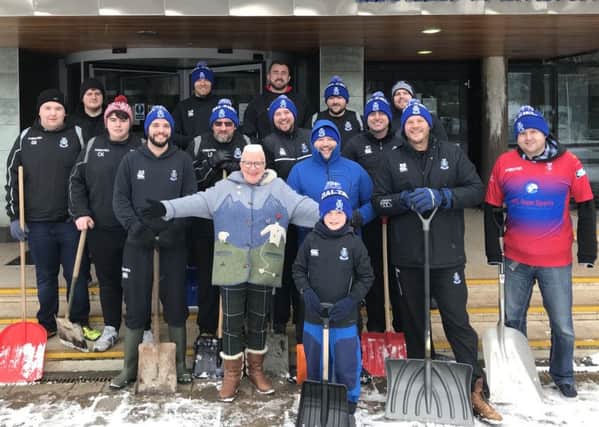 Players from Dalziel Rugby Club offered to clear snow