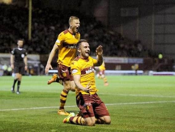 Motherwell pair Peter Hartley and Andy Rose celebrate the first goal of the Steelmen's 3-0 Betfred Cup quarter-final victory over Aberdeen earlier this season (Pic by Michael Gillen)