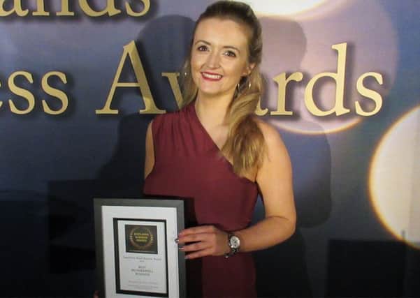 Stacey Neason with her Best Motherwell Business award