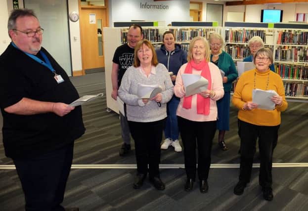 Alan Dryden and members of the singing group that meets in Giffnock Library.